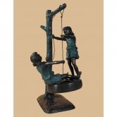 Bronze Children Swinging on a Tire Bronze Children Swinging on a Tire