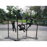 Bronze Kids playing on Monkey Bars Bronze Kids playing on Monkey Bars