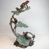 Bronze Frogs climbing on a Lily Pad Fountain Bronze Frogs climbing on a Lily Pad Fountain